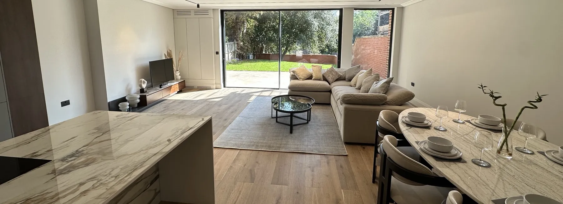 Open-plan kitchen and living room opening onto the garden at The Gables, Blackheath